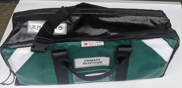 Green primary response bag with white flash