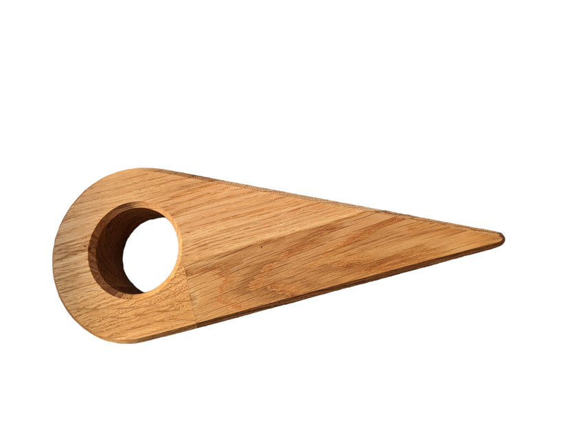 oak wedge for tucking in sheets with round hole for fingers and hands