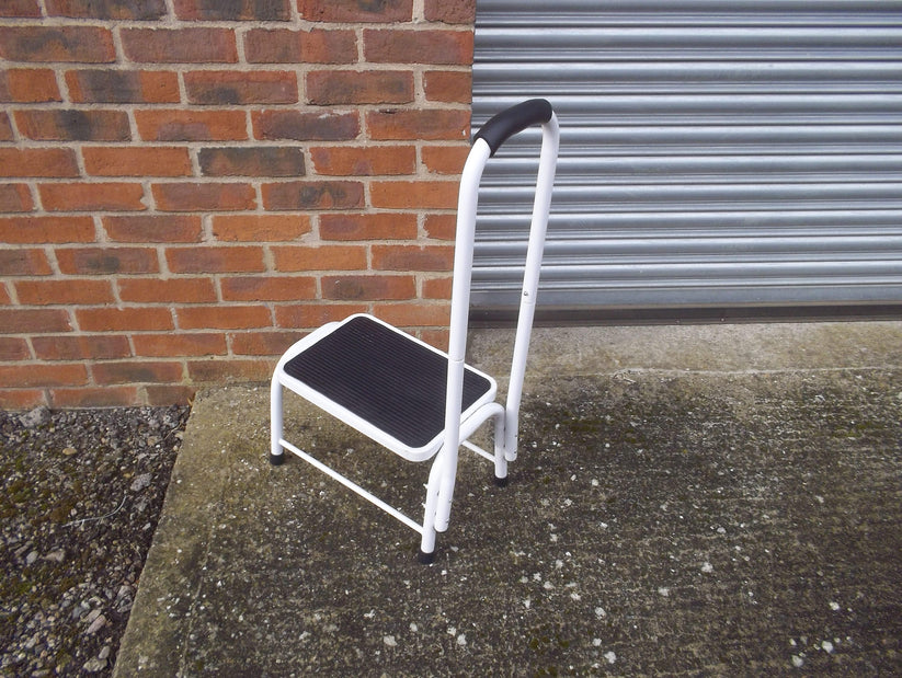 white stainless steel tubing stool with handrail and black nonslip step and handle